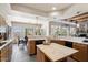 Large kitchen with wood cabinets, island, and expansive windows with mountain views at 43908 N 10Th St, New River, AZ 85087