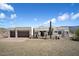 Two-story stucco home with a three-car garage and desert landscaping at 43908 N 10Th St, New River, AZ 85087