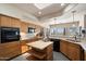 Kitchen with wood cabinets, an island, and views of the surrounding mountains at 43908 N 10Th St, New River, AZ 85087