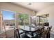 Bright dining area with mountain views and a rustic-style table at 43908 N 10Th St, New River, AZ 85087
