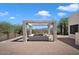Outdoor kitchen and BBQ area with pergola and mountain views at 43908 N 10Th St, New River, AZ 85087