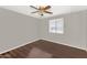 Bright bedroom with ceiling fan and wood-look flooring at 3829 W Thunderbird Rd, Phoenix, AZ 85053