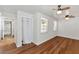 Bedroom with wood-look floors and access to bathroom at 3829 W Thunderbird Rd, Phoenix, AZ 85053