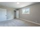 Well-lit bedroom with neutral walls and carpet flooring at 1018 S Lola Ln, Tempe, AZ 85281