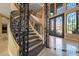 Elegant curved staircase with ornate metal railing at 1402 E Coral Cove Dr, Gilbert, AZ 85234