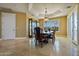 Elegant dining room featuring a large table, chandelier, and hardwood floors at 1402 E Coral Cove Dr, Gilbert, AZ 85234