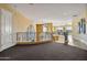 Elegant upper landing with curved staircase and plush carpeting at 1402 E Coral Cove Dr, Gilbert, AZ 85234