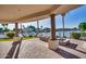 Spacious patio with fire pit and lake view at 1402 E Coral Cove Dr, Gilbert, AZ 85234