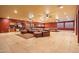 Finished basement with a bar, pool table, and comfortable seating area at 1402 E Coral Cove Dr, Gilbert, AZ 85234
