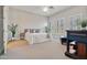 Spacious bedroom with a queen bed, plenty of natural light and plants at 1402 E Coral Cove Dr, Gilbert, AZ 85234