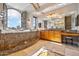 Upscale bathroom with a large soaking tub and views at 1402 E Coral Cove Dr, Gilbert, AZ 85234