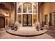 Impressive entryway with ornate double doors and lion statues at 1402 E Coral Cove Dr, Gilbert, AZ 85234
