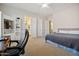 Bright bedroom with ensuite bathroom access and desk area at 1402 E Coral Cove Dr, Gilbert, AZ 85234