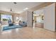Open living room with tile floors and access to other rooms at 1402 E Coral Cove Dr, Gilbert, AZ 85234