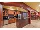 Basement kitchen with dark wood cabinets and granite countertops at 1402 E Coral Cove Dr, Gilbert, AZ 85234