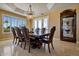 Elegant dining room with a large table and chandelier, hardwood floors at 1402 E Coral Cove Dr, Gilbert, AZ 85234