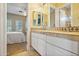 Elegant bathroom with double vanity and tile flooring at 1402 E Coral Cove Dr, Gilbert, AZ 85234