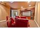 Luxurious home theater with red leather seating and large projection screen at 1402 E Coral Cove Dr, Gilbert, AZ 85234