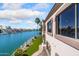 Home's exterior showcasing a waterfront view and lush landscaping at 1402 E Coral Cove Dr, Gilbert, AZ 85234