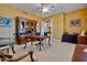 Spacious home office, featuring a large desk and comfortable chairs at 1402 E Coral Cove Dr, Gilbert, AZ 85234