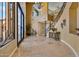 Elegant entryway with high ceilings and a curved staircase at 1402 E Coral Cove Dr, Gilbert, AZ 85234
