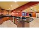 Basement wet bar with ample cabinetry and granite countertops at 1402 E Coral Cove Dr, Gilbert, AZ 85234
