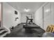 Well-equipped home gym featuring treadmill, weight machine, and free weights at 1402 E Coral Cove Dr, Gilbert, AZ 85234