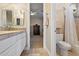 Bathroom with double vanity, toilet and shower/tub combo at 1402 E Coral Cove Dr, Gilbert, AZ 85234