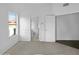 Bright bedroom with neutral walls, carpet flooring, and access to bathroom at 6447 W Escuda Rd, Glendale, AZ 85308
