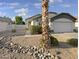 Single-story house with desert landscaping and a two-car garage at 6447 W Escuda Rd, Glendale, AZ 85308