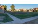 Community view showing green spaces and residential buildings at 6337 N 49Th Ave, Glendale, AZ 85301
