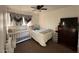 Bedroom with a crib, double bed, and dresser at 6337 N 49Th Ave, Glendale, AZ 85301