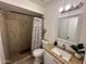 Bathroom with shower, toilet, and granite countertop at 6337 N 49Th Ave, Glendale, AZ 85301