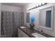 Double sink bathroom with granite countertops and mirrors at 6337 N 49Th Ave, Glendale, AZ 85301