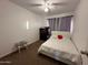 Bedroom with a queen bed, dresser, and plenty of natural light at 6337 N 49Th Ave, Glendale, AZ 85301