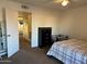 Main bedroom with crib, dresser, and view of hallway at 6337 N 49Th Ave, Glendale, AZ 85301