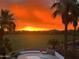 Sunset view overlooking the pool and backyard at 7520 S Estrella Pkwy, Goodyear, AZ 85338