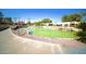 Community pond with fountains and walking path at 14300 W Bell Rd # 444, Surprise, AZ 85374