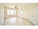 Living room with tile floor and large window at 14300 W Bell Rd # 444, Surprise, AZ 85374