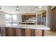 Island kitchen with granite countertops and pendant lighting at 38718 N 24Th Ave, Phoenix, AZ 85086