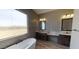Spa-like bathroom with a soaking tub and double vanity at 38718 N 24Th Ave, Phoenix, AZ 85086