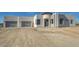 Modern home exterior with a two car garage and desert landscaping at 38718 N 24Th Ave, Phoenix, AZ 85086
