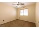Well-lit bedroom with carpeted floors and window blinds at 10649 W Monte Vista Rd, Avondale, AZ 85392