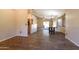 Bright dining room with wood flooring and a view into the living room at 10649 W Monte Vista Rd, Avondale, AZ 85392