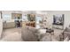 Open floor plan with modern kitchen, island, and comfortable living area at 900 N Windy Meadow Ln, Maricopa, AZ 85139