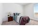 Cozy bedroom with a twin bed and wood nightstand at 900 N Windy Meadow Ln, Maricopa, AZ 85139