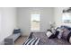 Bedroom with a queen bed and bench at 900 N Windy Meadow Ln, Maricopa, AZ 85139