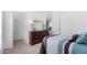 Bedroom with twin bed, dresser, and closet at 900 N Windy Meadow Ln, Maricopa, AZ 85139