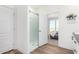 Clean bathroom with a walk-in shower and view into the bedroom at 900 N Windy Meadow Ln, Maricopa, AZ 85139