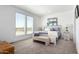 Main bedroom with plush carpet and large windows at 900 N Windy Meadow Ln, Maricopa, AZ 85139